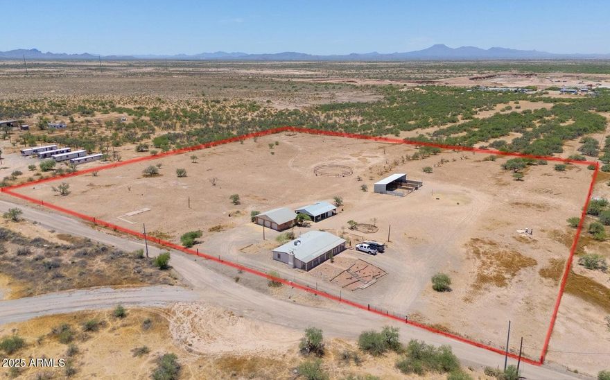 Don't miss this rare opportunity to own a fully fenced 10.037-acre horse property with two private registered wells, just minutes from town offering both convenience and total privacy with beautiful mountain views.
The property includes a detached 3-car block garage with workspace, barn, chicken coop, round pen, and four horse stalls perfect for equestrian use. Nearby trail access adds even more appeal. The sturdy 2 bed, 2 bath block home offers comfortable living, featuring a living/dining area with fireplace and a spacious great room. Both bedrooms are generously sized with ample storage. 
Whether you're looking to board horses, start a business, provide employee housing, or simply enjoy the space this property offers incredible flexibility and opportunity. Send in your offers! This is more than a property; it's your next big adventure waiting to unfold!