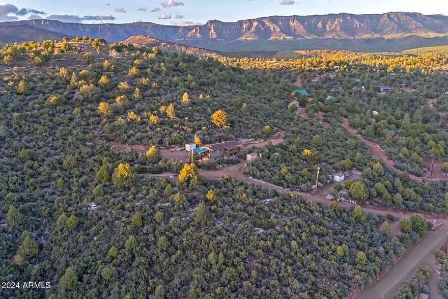 Stunning views from this pristine lot, featuring a flat area midway up and a driveway leading to a building pad. GU zoning allows for up to five dwelling structures, and the lot offers potential for splitting—endless possibilities! Water and electricity are already installed, making it even more ready for development.