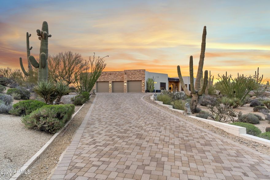 Welcome to luxury living in the prestigious gated community of Troon Verde in North Scottsdale. Situated on a sprawling 2.12-acre corner lot, this immaculate custom estate offers unparalleled privacy and stunning panoramic views.

The property features a 4-car garage equipped with high-end car lifts, allowing you to store up to 8 vehicles. Additional highlights include a new roof, a fully owned solar system, new HVACs, a newly renovated pool and pool equipment, and an outdoor bathroom. Entertain in style with a dedicated movie theater room, perfect for family movie nights or hosting friends. Enjoy your favorite vintages in the elegant wine room, designed for the connoisseur. Plus, there's convenient side RV parking for your adventurous getaways. This estate truly encompasses the ultimate in luxury living, with exceptional features that cater to all your desires.This one-of-a-kind, perfectly sized custom home with a eight-car garage on this acreage is hard to find and even harder to duplicate. Do not miss out on the chance to own this unique property!