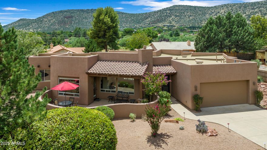 Experience the best of Sedona living in this meticulously maintained, fully furnished home, perfectly positioned to capture commanding red rock views from the front courtyard, great room, and dining room.  Thoughtful upgrades include stained glass accents, rich solid wood doors, Hunter Douglas Ultra-Glide window coverings, custom cabinetry, granite countertops, and stainless steel appliances.  At the center of the home, a dramatic stacked moss rock fireplace anchors the living room--perfect for cozy evenings and memorable gatherings. Step outside to two exceptional outdoor living spaces: a spacious front courtyard with breathtaking views for relaxing or entertaining under Sedona's endless skies.  Offering abundant storage, timeless finishes, and furnishings included for a seamless move-in experience, this turnkey retreat blends comfort, style, and the unmatched beauty of Sedona.