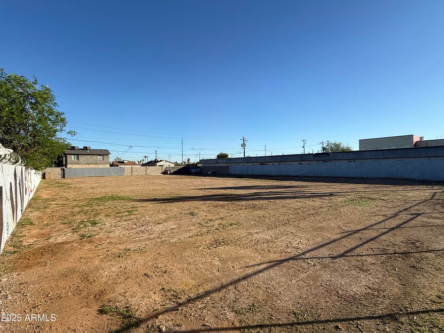 Special opportunity zone development opportunity right off the I-10, just 5 minutes from the airport and 5 minutes to downtown Phoenix. Zoned C-3 which allows for an expansive list of commercial and multifamily uses. Owner has approved permits for construction of a 5300 sf warehouse. New water meter outside by side walk and electric plans and permit approved by APS (panels included).