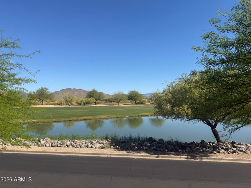 If you love mountain views, a lake view, & a golf course view, then this is the condo for you.Enjoy the rare trifecta of all three in one incredible setting!! Welcome to this beautifully maintained condo in the highly desirable Dove Valley Ranch community.This light-filled residence features an open-concept floor plan with spacious living/dining areas, perfect for both relaxing & entertaining. Large windows frame the stunning scenery. This upstairs unit has been beautifully refreshed with new flooring,new 5-inch baseboards,fresh interior paint, & bright new lighting . The kitchen is well-appointed with ample cabinetry, generous counter space, & a breakfast bar that opens to the main living. The primary suite is a private retreat, complete with an ensuite bathroom and walk-in closet. The split plan allows the additional bedrooms to offer flexibility for guests, a home office, or hobbies. Step out onto your private balcony and take in sweeping vistas of the surrounding mountains, tranquil lake, and manicured fairways--Residents of this gated community enjoy resort-style amenities, including a sparkling pool, spa, fitness center, and beautifully maintained grounds. This home delivers a rare opportunity to enjoy spectacular views and low-maintenance living in one of North Phoenix's most sought-after communities.