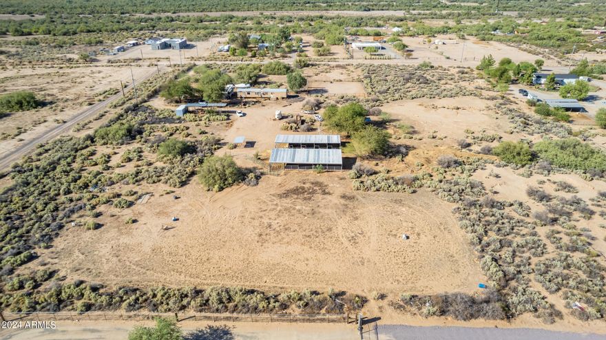 ''Fantastic opportunity to own 5 acres of vacant land in Buckeye with stunning mountain views! This low-density area offers privacy and space, with all neighboring lots being 3 acres or larger. The property features a shared well, and power is already on the lot, making it ready for your dream home or investment. Located off Elliot Rd, west of Airport Rd, you'll enjoy the quiet surroundings with minimal traffic. Don't miss this chance to secure a prime piece of land in a growing area!'' Also for sale 3 acre lot to the east. MLS# 6758082