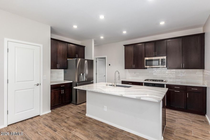Why wait for a new build when you can move into a beautifully upgraded, nearly new home NOW?

This move in ready Surprise home already includes the upgrades buyers are paying extra for with new construction, helping save time, stress, and additional out of pocket costs.

To help maximize affordability, this home may also qualify for lender paid rate buy-down incentives* PLUS a 1% down payment assistance grant for qualified buyers.

If your goal is to keep your monthly payment as manageable as possible while still owning a modern, upgraded home, this opportunity deserves a closer look. Enjoy resort style amenities, tree lined streets, community pools, parks, walking paths, and the kind of neighborhood buyers are actively searching for.

Conveniently located for commuters and just a short drive to Luke AFB, this home may be especially appealing for buyers looking to maximize their budget, leverage BAH strategically, and begin building long term wealth through homeownership.

Beyond the photos and features, this home offers something buyers are prioritizing more than ever: lifestyle, convenience, community, and overall value.
