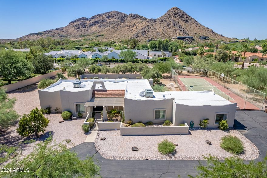 Flat 1.063 acre North/South parcel in the heart of Paradise Valley with a South facing backyard that offers amazing Mummy Mountain views.  Ideal opportunity for new owner / builder to design a new home that captures very hard to replace views of Mummy Mountain on a lot located with ideal access to the heart of Paradise Valley.  Home is 1 block away from Cherokee Elementary school and easily accessible to all of Metro Phoenix, Hwy 101, Old Town Scottsdale, etc.