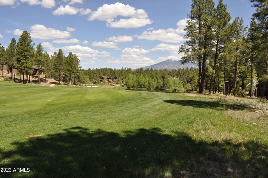 This beautiful 0.47-acre homesite backs directly onto the 18th fairway of Pine Canyon Golf Club's award-winning golf course, offering sweeping panoramic views of the surrounding landscape and the majestic San Francisco Peaks. Set among towering Ponderosa pines, this premier location presents an exceptional opportunity to embrace the refined mountain lifestyle within one of Flagstaff's most sought-after private communities. Lots 291 and 292 shall be uncombined prior to Close of Escrow, should they sell separately.