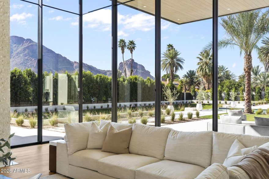 Experience stately views from this timeless Brand New Estate in one of the most desired neighborhoods in Paradise Valley with BIG VIEWS from every room.

The Great Room opens to epic views of Camelback Mountain, with 18ft tall motorized pocketing doors to match the impressive ceilings, seamlessly blending indoor & outdoor living. 

The custom Kitchen, full Catering Kitchen, double islands, & indoor/outdoor Bar continue into the Dining Room with custom refrigerated Wine Cellar & Game Room. 

The Primary Suite is well appointed with amenities and 2 outdoor retreats...A nearby suite for Gym or Flex Space and a split floorplan with 3 Junior Suites around a Den plus a full Detached Guest Home.  

The quality of finishes is unsurpassed!