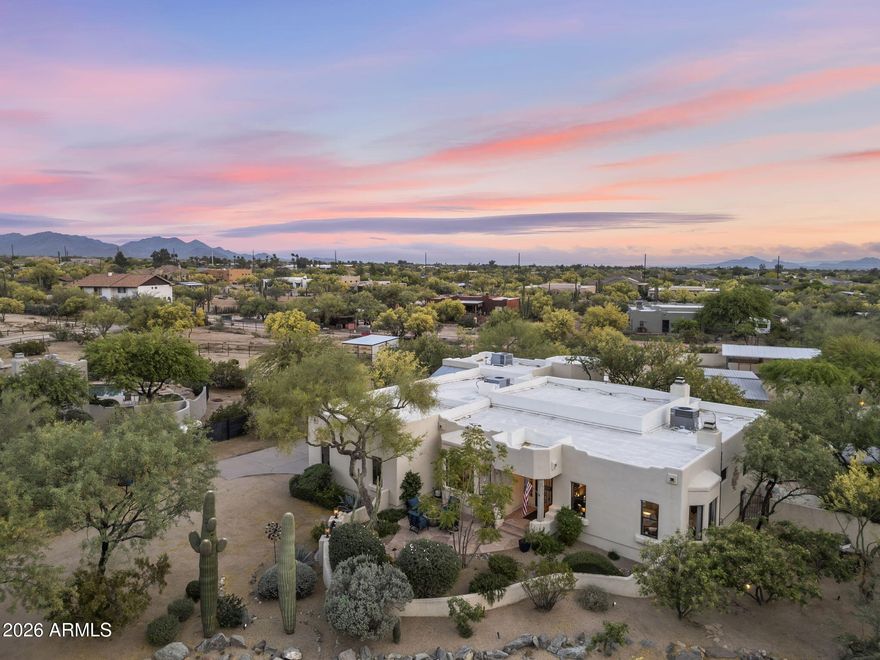 Where refined luxury meets the spirit of the Sonoran Desert. Set on over an acre in Cave Creek, this private equestrian estate offers sweeping sunsets, unmatched serenity, and effortless access to premier dining and shopping. Thoughtfully designed for both sophisticated living and an elevated Western lifestyle, the grounds feature horse stalls, a tack room, and beautifully appointed outdoor spaces for entertaining beneath open skies. Inside, 4 spacious bedrooms include a versatile attached casita. The primary suite is a true retreat with a soaking tub and expansive closet, while the chef's kitchen, exposed vega beams, statement fireplace, and seamless indoor-outdoor flow create a home that is both timeless and exceptional.