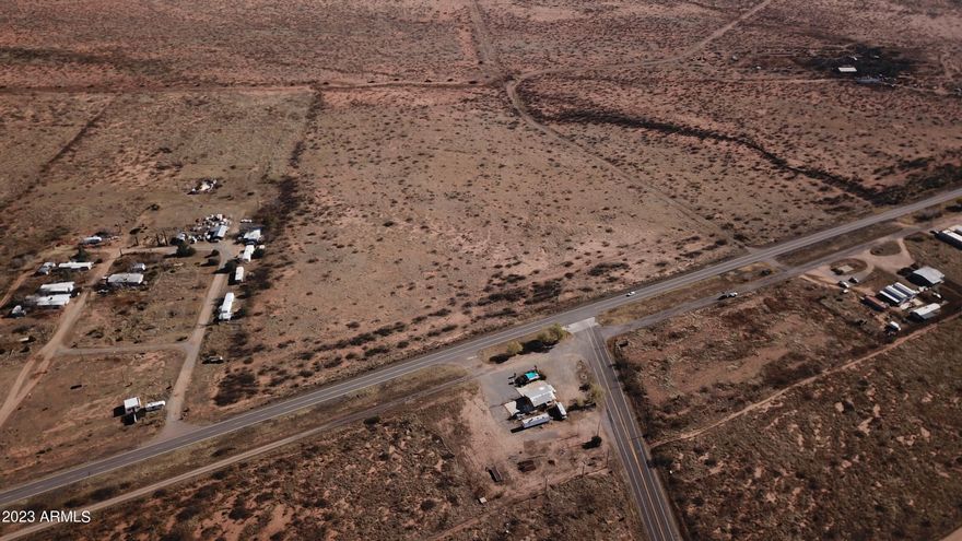 This combined 22.5 AC Parcel is a unique BUSINESS OPPORTUNITY IN A FANTASTIC LOCATION offering 716' of Hwy 191 FRONTAGE at the intersection of Ironwood Rd which is THE ENTRANCE TO COCHISE STRONGHOLD. The Ghost Town Trail runs directly south out of Pearce to Gleeson and other nearby historic sites. Lots of traffic to nearby vineyards and other points of interest. Enjoy the views of the Chiricahua Mountains. Lots of POTENTIAL!  Ideal property for COMMERCIAL DEVELOPMENT for Gas Station-Restaurant-Motel-Retail Shops! This listing is inclusive of 2 Parcels: 114-11-005A (7.5AC) and 114-11-005B (15AC). Parcels may be sold separately.