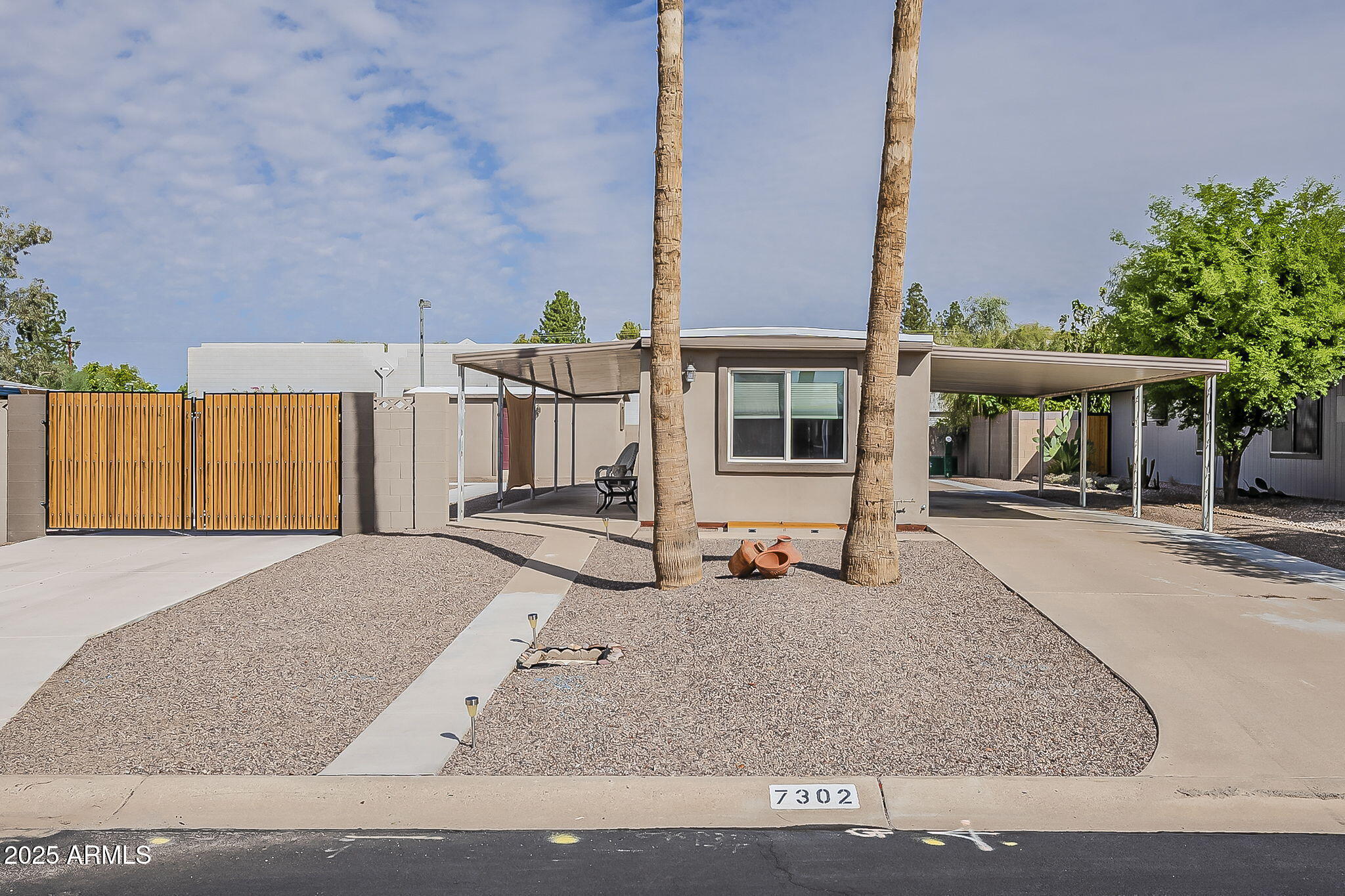 7302 E ABILENE Avenue