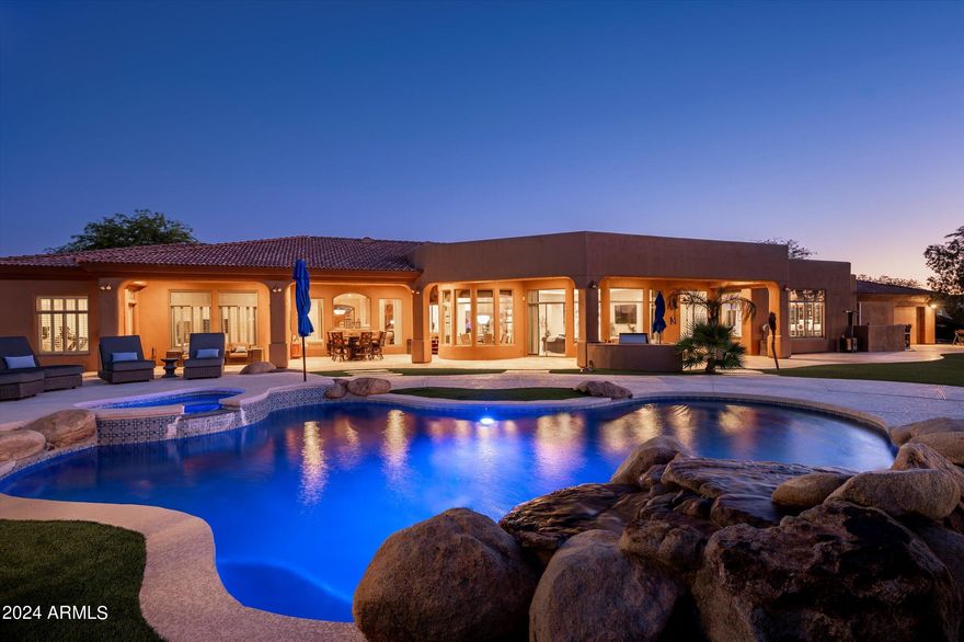 Welcome to a luxurious estate nestled in the heart of Scottsdale, Arizona, in the highly coveted 85259 zip code. This magnificent home, sitting on 1.35 acres of pristine land, boasts 5,067 square feet of meticulously renovated living space with 5 spacious bedrooms and 6 elegant bathrooms.  With breathtaking and unobstructed views of the McDowell Mountains form the great room and backyard, this residence is the epitome of luxury, style, and functionality.
Perfect for the car enthusiast, the property features not one, but two separate garages, one of which is for 3 cars, temperature-controlled, and has drive-through access to the backyard—perfect for housing your prized collection. The exterior showcases newly installed garage doors, adding to the home's modern appeal. Inside, the gourmet kitchen is a chef's paradise, outfitted with double islands, brand-new cabinetry, and top-of-the-line Sub-Zero, Wolf, and Cove appliances. With a walk-in pantry and additional appliance closet, keeping everything organized is a breeze. Whether hosting an intimate gathering or a large celebration, this home is designed to entertain in style, complete with multiple ovens, a warming drawer, and an integrated wine refrigerator. 
The expansive floor plan offers plenty of room for both intimate gatherings and large celebrations, including a fully equipped "man cave" complete with a built-in bar for the ultimate entertainment experience.
The five ensuite bedrooms offer luxury and privacy for family and guests alike, with large picture windows framing the stunning mountain vistas. The master retreat is a true sanctuary, complete with a mirrored fitness room, a spacious walk-in closet, and a spa-like bathroom featuring a luxury smart toilet/bidet, separate tub, and walk-in shower.
Step outside and discover a private oasis in the expansive backyard. Recently renovated with synthetic grass and elegant tile, the outdoor space includes a deluxe chicken coop, a sauna/spa with both indoor and outdoor showers, and an RV slab with full hookups for ultimate convenience. With ample room to add a tennis or pickleball court, this estate is a haven for recreation and relaxation.
Backing up to a serene wash, the property offers unparalleled privacy and tranquility, while being just minutes from all that Scottsdale has to offer. This is more than a homeit's a lifestyle.