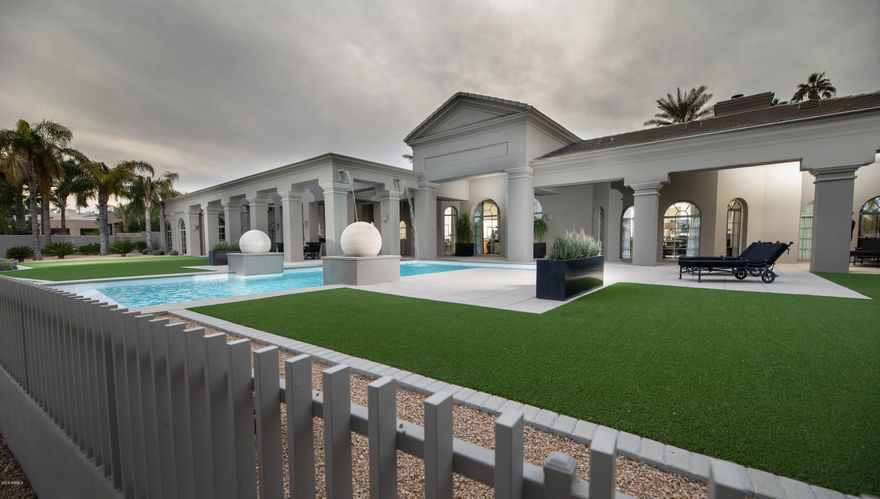 This captivating Vaquero Drive home has been completely remodeled by the Owner/Designer and situated at Vaquero's best location...overlooking the 6th hole of the Arroyo Golf course and Lake. The grand entrance invites you into the domed foyer to the living room's back-lit barrel ceiling with dining area; looking thru the contemporary wooden columns to the negative edge pool. The well-designed floor plan features 3 Bedrooms, 4.5 baths, stunning Library and attached Casita/Office. The striking black kitchen has large 3'' eased edge granite breakfast bar, stainless appliances, glass back-splash and dramatic lighting features. The great room's inset ceilings with Egg and Dart crown molding and granite faced fireplace have direct access to the 100+ bottle wine storage and the resort style patio A stunning Master Bedroom suite with granite fireplace and sitting area opens to a custom bath including Kerns Wilcheck Vanities with black granite counters and gold hardware. The His & Hers master closets are highlighted by the eased edge granite counters, glass front cabinets and built-in storage. This polished marble flooring through out the split floor plan with attached Casita/Office, full bath and private entry add to the attraction of the home. Majestic views, negative edge pool and resort style synthetic grass front/back yards make this a true one of a kind for the lock and leave Gainey Ranch lifestyle.