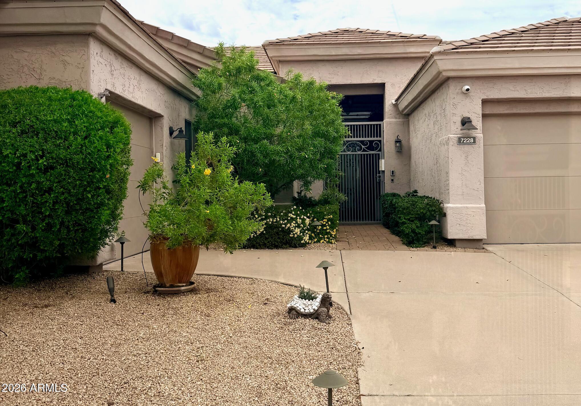 7228 E WHISTLING WIND Way