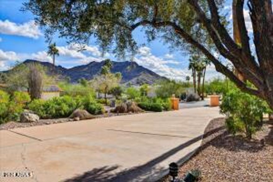 Tremendous value offered in this buildable flat lot with 360 degree mountain views in prestigious, secluded Tatum Canyon.  NO HILLSIDE ORDINANCE, NO HOA on this one!  Existing 1976 era home just under 6000 s.f. is fully livable and meticulously maintained, leaving footprint in place to create a new masterpiece for modern living.  Stellar mountain views, quiet location, convenient commute for airport travel, private schools, shopping, dining, freeway access.