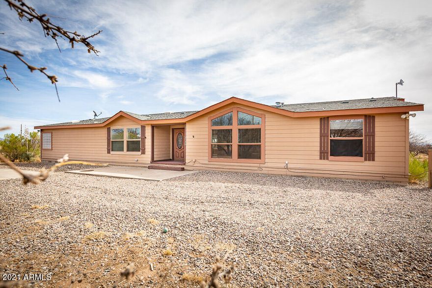 Surprisingly beautiful triple wide manufactured  home on 4 acres . Impeccably taken care of . Gorgeous views from every angle . You really must see to appreciate the serenity and majesty of the area !