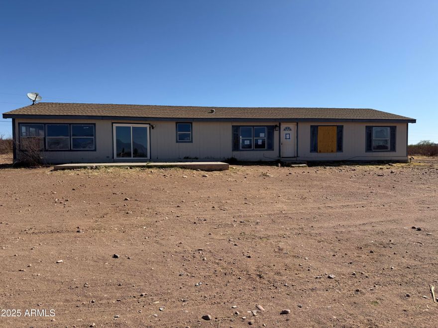 Are you looking for a very reasonable property with a mountain view? Take a look here. This home site on 4.5 acres and it is fenced and has 2 outbuildings. There is a well share and a septic system. The home does have a good floor plan and 4 bedrooms. There is central a/c as well.