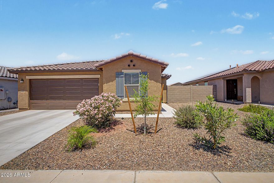 Immaculate and move-in ready, this beautifully maintained home is located in a desirable gated community and is less than 3 years old! The updated kitchen features granite countertops, stainless steel appliances, and gorgeous light gray laminate flooring throughout. Bright, modern, and meticulously cared for, this home offers both style and comfort in every room. Conveniently located less than 30 minutes from downtown Phoenix and Phoenix Sky Harbor International Airport, with easy access to shopping, dining, and entertainment. A must-see!