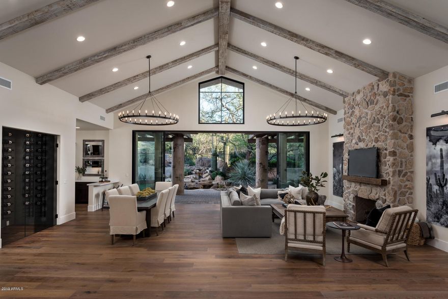 New 2018 - 5500sf - single level lock & leave in Scottsdale's most prestigious guard gated community! The absolutely BEST gated home under $3 million in the entire valley. Remodel done by Arizona's premier design/build/remodel firm. Private guest house with 2 bedrooms/2 baths & kitchen with Sub-Zero refrigerator. 2 luxurious master suites with white Italian marble, walk-in closets, sitting vanities, and separate freestanding tubs. Amazing open floor plan with zero steps. Huge kitchen with all new custom inset cabinetry, quartz countertops, Sub-Zero/Wolf appliances, Fleetwood sliding door, new plumbing, electrical, drywall, interior doors, etc-lives like a brand new home. Smart home with separate climate controlled wine room, gas fireplaces, European oak hardwood flooring. A must see