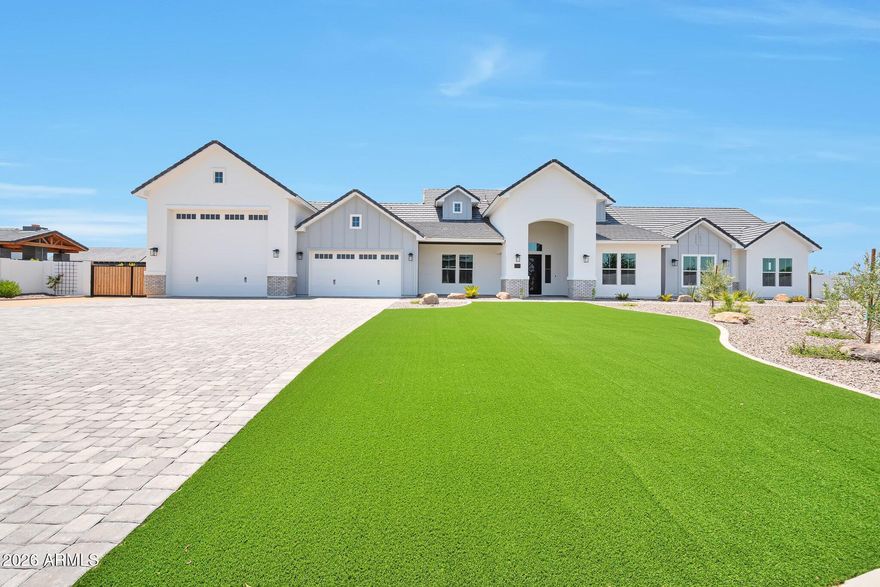 Stunning custom home highly upgraded with wood plank tile floors, gourmet kitchen with oversized Quartz Island and counters, expansive white cabinets with trendy hardware. Thermador stainless appliances with 6 burner gas cooktop. Dining room with custom millwork adding decorator touch! Lavish master bath, Rain shower, separate tub, oversized walk-in closet. 14' RV garage plus 2 car garage. Exterior Turf front, travertine covered patio, firepit, pool and putting green. Tall custom 8' front door, Energy efficient Green Features, 2x6 construction .