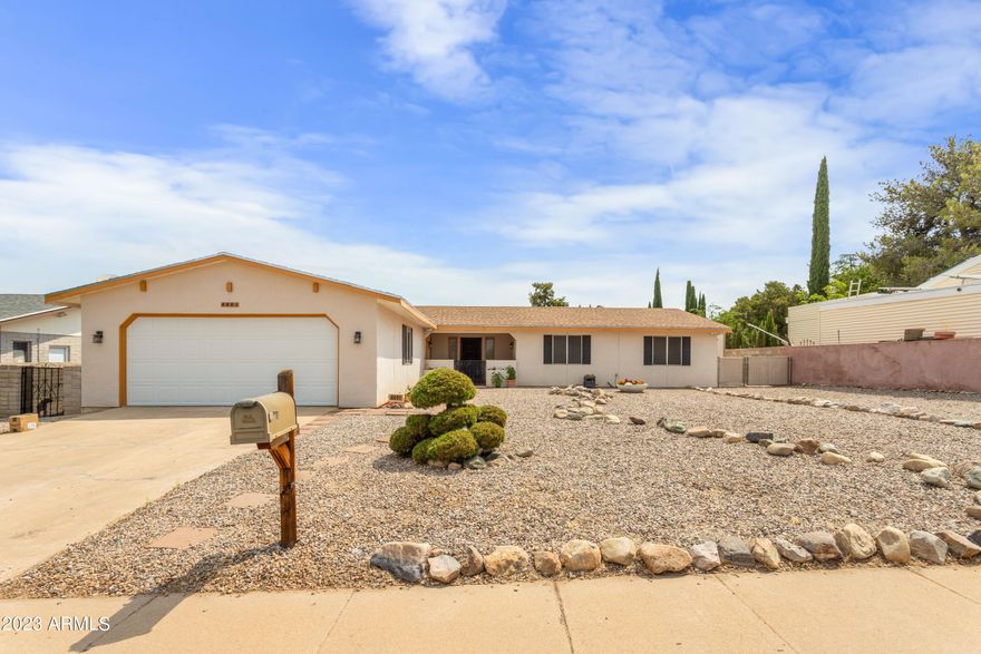 Step in to the courtyard and start planning the perfect retreat! Fantastic north south exposure give this home ideal areas to enjoy the outdoors throughout the day. Be welcomed through the front door by a beautiful stone work fireplace in the Living room off to the left you will find a large den and eat in kitchen ready to whip up new memories in. To the right are wonderfully sized bedrooms perfect for any space you need! Out back you will find a raised deck and freshly installed sod, complete with separate dog run! Even more!  There is a shed to store whatever you might need PLUS an RV gate! Don't miss this centrally located gem!