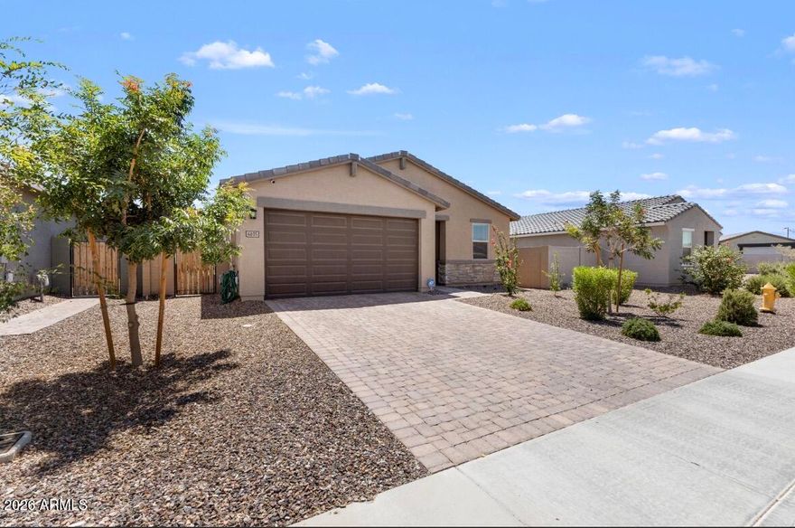 Welcome home to this stunning 2023-built Meritage home featuring 4 bedrooms, 2 bathrooms, and modern finishes throughout. Enjoy an open-concept floorplan with a spacious kitchen showcasing granite countertops, white cabinets, stainless appliances, and oversized island seating. The private primary retreat offers dual sinks, abundant storage, and a large walk-in closet. Outside, enjoy a covered patio, expansive grassy backyard, and low-maintenance landscaping. Modern construction, energy efficiency, and move-in ready convenience all in one package.