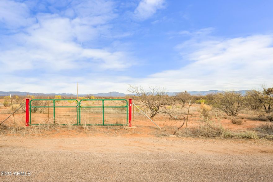 Almost One Acre parcel on property less than 5 minutes from Walmart and Fry's. Fenced, level lot with views of the Huachuca Mountains. Two roads give access to almost a square lot.  Drive by any time to view.