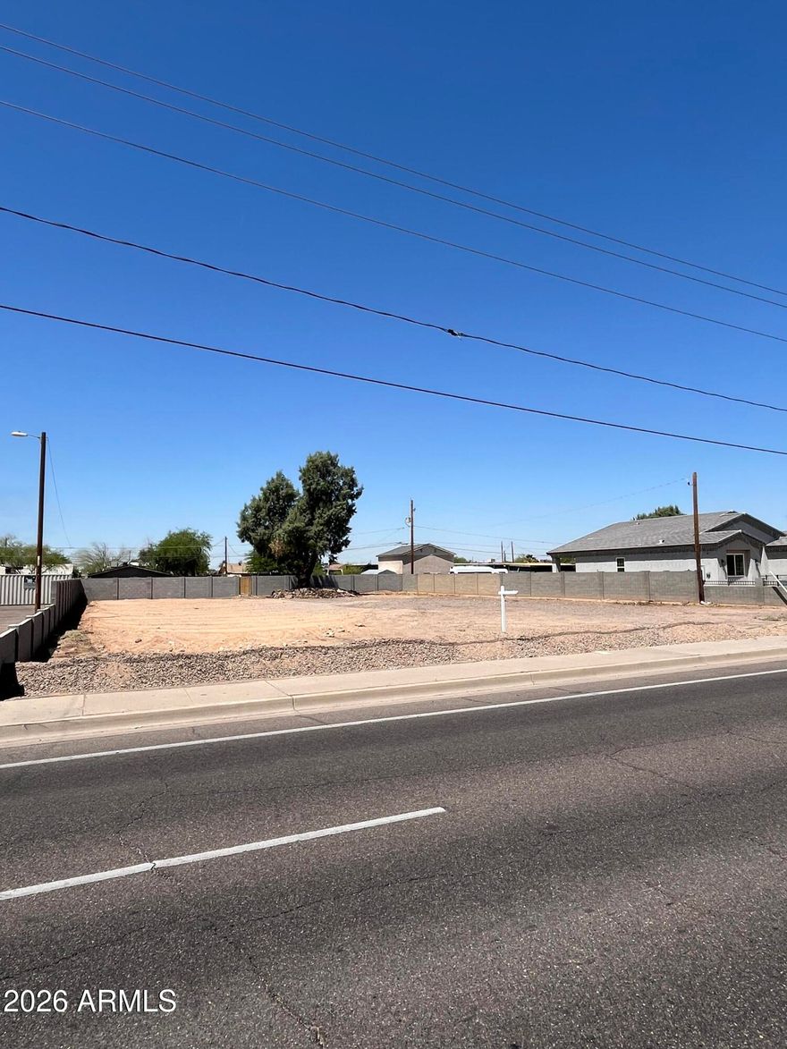 .44 Acre oversized lot 110' x 174'  Utilities onsite with secure block fence zoned R5 multi-family. Perfect for custom residential or multi-family use.
Electric pole on NW corner of lot.
Water meter at sidewalk.
Sewer line capped next to tree/ pedestrian gate, (there is a cement block identifying its location). 
Buyer to verify all.