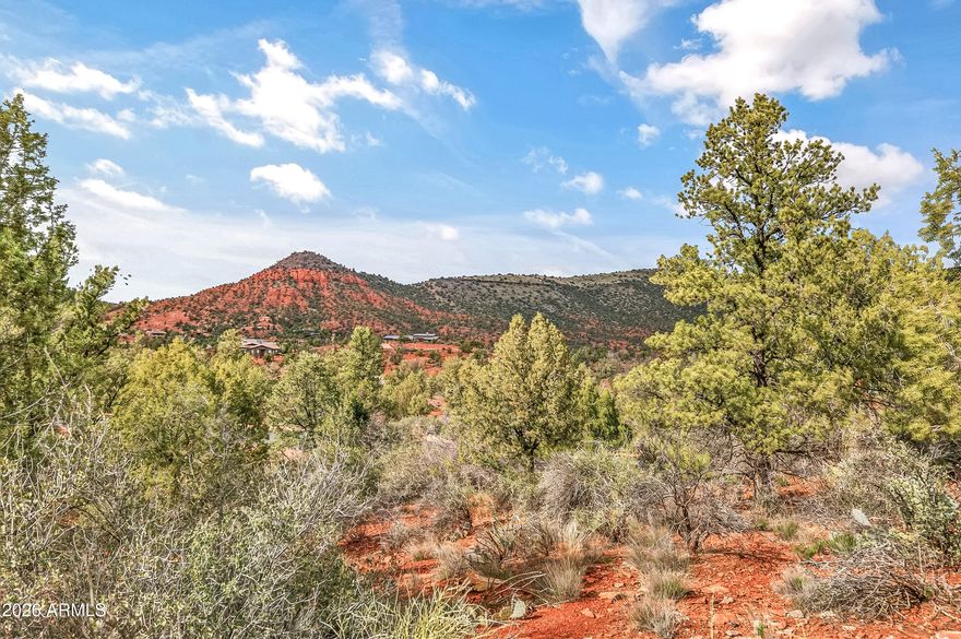 Rare opportunity to own in a gated community in Sedona, AZ. Cross Creek Ranch offers stunning and unspoiled, world-famous red rock views and is surrounded by beautiful custom residences. This unique lot is one of only two in the subdivision with dual building envelopes, providing added flexibility and the possibility of a detached guest house. Enjoy the natural beauty of the area, with community hiking trails and multiple access points to bordering Oak Creek. With a Red Rock State Park Pass, you can use the private gate that accesses the adjacent park for an additional 286 acres of hiking, wildlife, and additional views along Oak Creek.