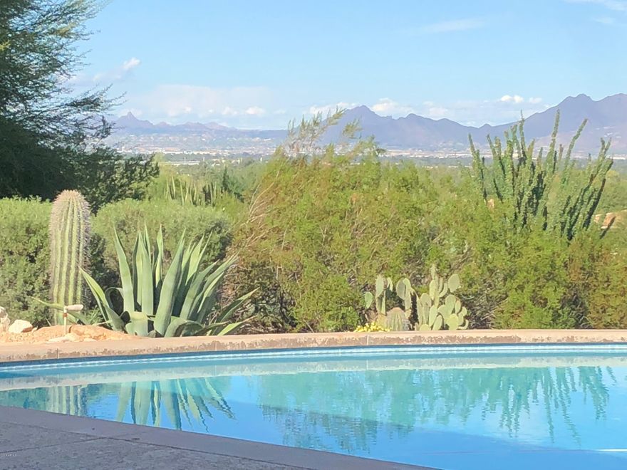 360 DEGREES OF VIEWS IN ONE OF THE BEST PV QUADRANTS!!  Prime elevated 2.52 acre flat lot with a gentle slope. NON HILLSIDE ORDINANCE.  Unobstructed views of Carefree, Pinnacle Peak, Four Peaks, Red Mountain, Mummy Mountain etc. 5,500+ SF contemporary home with floor to ceiling windows that take advantage of the spectacular site. Home has a finished basement with full kitchen & full bath.  Entertainers dream backyard  with various patios, bar/cabana, outdoor kitchen -  600 amp service available. Perfect remodel, or build your dream home on 2.5 acres of privacy.