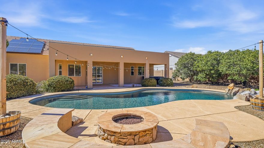 Live the Arizona dream in gated La Terraza! This stunning 4-bedroom, 2-bath home on nearly ½ acre features a sparkling pool with fountain, outdoor kitchen, firepit lounge, and breathtaking mountain views--perfect for unforgettable sunsets. Inside, enjoy granite countertops, gas range, double pantries, breakfast nook, formal dining, and two spacious living areas. The private primary suite offers a bay window, dual sinks, soaking tub, walk-in shower, and large closet. Bonus: owned solar for energy savings, smart thermostat, and water purification system. Your perfect blend of comfort, style, and outdoor living awaits!