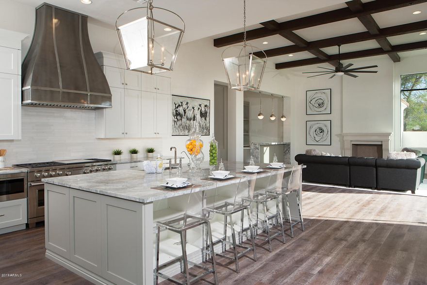 Stunning Custom New Build from Norton Luxury Homes is situated on a large Cul-de-Sac Camelback Country Club Estates Lot. Timeless split floor plan features 5 bedrooms, office, game room and 7 baths. European Oak wood floors throughout. Beautiful white kitchen with classic marble counters & island including upscale appliances. Entertainer's bar with dual-zone wine fridge positioned perfectly in the family room looking to stunning views of the Mummy Mtn. The Spacious Master suite boasts separate his/hers walk-in closets and kitchenette. The grand master bath features marble finishes, oversized shower, soaking tub & private outdoor shower. Family and Living room's sliding glass walls overlook the amazing pool & fire feature and extended 4 car garage add to the home's splendor. (Owner/Agent)