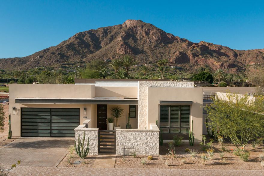 Luxury New Home with iconic Camelback Mountain views and golf views in the Mountain Shadows Resort Paradise Valley location. Take advantage of resort living w/ full amenities (concierge, Sanctuary spa,pools,yoga,Pilates and more) at the adjacent resort.Enjoy the essence of distinct architectural designs that include indoor/outdoor living when 12 ft indoor ceilings are joined together by 9 ft high bi-fold doors to an outdoor livable patio. Luxurious designer features include, Wolf combo dual fuel range oven, steam oven and microwave, Sub Zero refrigerator, wine storage cabinet, 2 Asko dishwashers, 48'' Zephyr hood, Restoration Hardware fixtures, indoor/outdoor fireplaces, 4 bedrooms, 4.5 bathrooms,Den/5th bedroom,master retreat, 2 car driveway, 2 car garage 24 hr guarded entry, & more