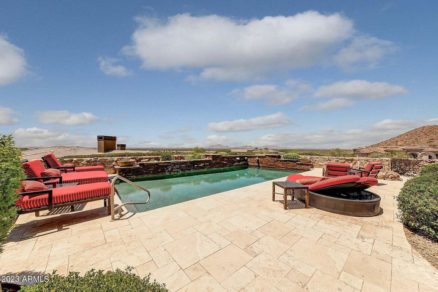 This is a rare opportunity to own a single level home on the mountain with the most spectacular views in the valley, (THERE ARE NO INTERIOR STEPS). Updates this year solar, pool, Savant system and tankless hot water heater. Home is beautifully appointed with wood and stone floors and custom interior paint. This home is the perfect size and in the guard gated community is the perfect lock and leave for when your client wants to travel or have this as a second home. For the person who likes to entertain or cook the gourmet kitchen has double ovens, a large breakfast bar, and a huge pantry. The family room has a wet bar that has a 150 bottle temp. controlled wine fridge. You walk out back to an 800ft patio that leads to the heated pool and spa, fire pit and BBQ. Finally the 4 car split garage is perfect for the car enthusiast