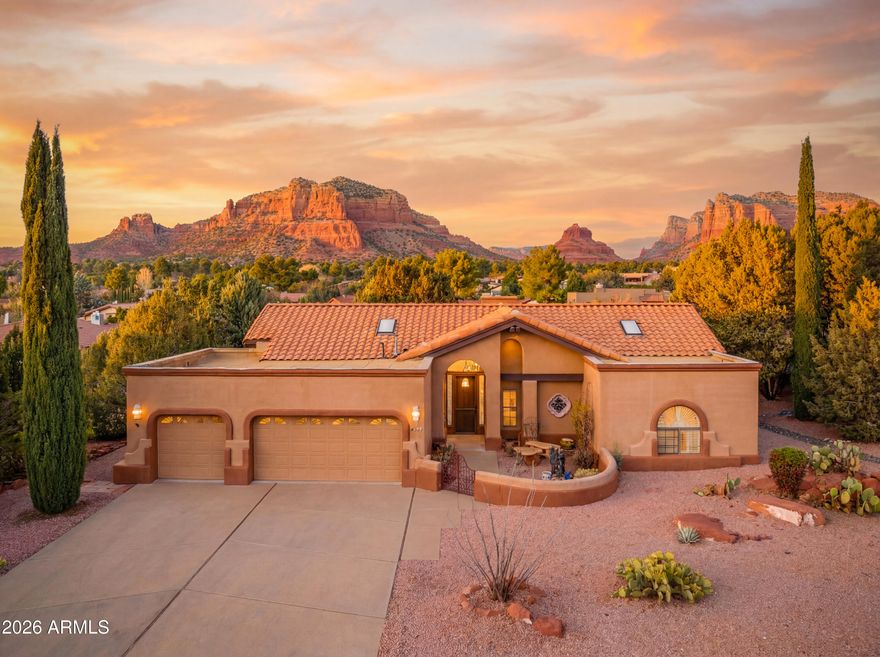 Discover a rare opportunity at 86 Ridge Rock Rd, a single-family home situated within The Ridge community. This property is one of a few detached homes in the complex, offering exceptional privacy and space while still benefiting from a desirable community setting. The location offers stunning views of the iconic Bell Rock and Courthouse Butte from the expansive deck and main living areas. Step inside to a home designed for comfort and connection to the Sedona landscape. The living room features a dramatic 16-foot Cathedral ceiling with exposed wood beams and large arched windows that frame the red rock scenery. A custom-built fireplace creates a warm focal point for the room. The Kitchen is efficiently designed with stainless steel appliances and  Australian granite counters,Durable travertine flooring flows seamlessly throughout, complemented by wood in the guest bedroom. The primary suite is comfortable and private, featuring a cedar-lined walk-in closet and a spacious en-suite bathroom. The primary bath includes a jetted tub, a separate shower, and a bidet. The guest bedroom features a large closet with a full guest bath nearby. The third bedroom is a flexible space, it is curently utilized as a home office. The home maximizes the outdoor experience with a large deck in the back, ideal for entertaining. The surrounding landscaping is maintenance-freea generous oversized 3-car garage with room for a workshop.
Ownership of this home includes a valuable membership to the Hilton resorts spa and athletic club, granting access to premier fitness and wellness amenities right outside your door.