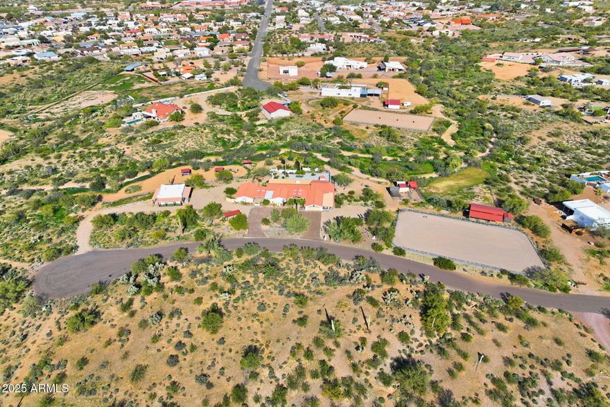 Set On Almost 4 Acres With Sweeping Panoramic Superstition Mountain Views w/ Heated Pool & Spa, This Horse Property Delivers The Full Equestrian Lifestyle. Built For 8+ Horses, The Setup Includes A Large Sand Arena, Lit And Covered Stalls, Paddock, Turnout, Chicken/Peacock Coop And A Round Pen. Riding Trails Connect Directly To The Property, Eliminating The Need For Any Trailering. The Single-Level Main Home Offers 2,650 Sq Ft, UPDATED & UPGRADED-New Roof 2025, Recently Added 32X32 Detached Garage, Gourmet Chef's Kitchen Featuring A Giant Quartz Island, Bright LED Lighting And A Walk-In Pantry. Open Great Room Concept. Formal Sunken Living Room With A Fireplace. Indoor Workshop. The Primary Suite Showcases An Updated Bathroom And Giant Walk-In Closet. The Full Guest House Is 1,024 Sq Ft.