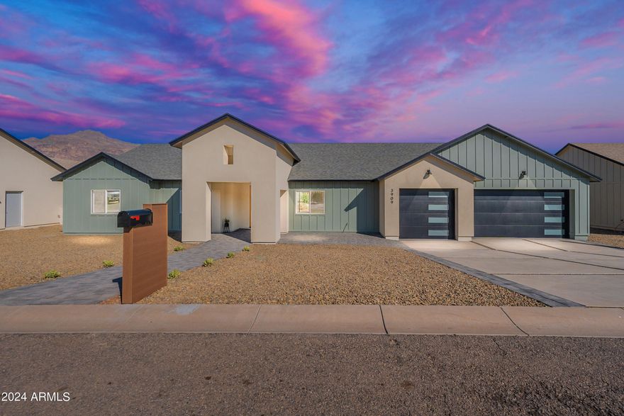 Welcome to Montana Dorada, the best kept secret in Gold Canyon Arizona. This single level home is part of an exclusive Modern Farm Desert Collection. Offering paved roads and iconic views of the Superstition Mountains. Over 5000 sf under roof and 2989 livable. A large covered backyard patio. Complete with 4 bedrooms, 3 bathrooms, large island, beverage bar, and a butler's pantry. Sitting on a large lot with space to design a perfect outdoor oasis. This split floorplan offers a large owners' suite and private entrance. Guests can also enjoy a beautiful ensuite with a private entry as well. Designed with earthy organic neutral accents, with timeless features. Complete with a three car garage with epoxy flooring. The neutral earthy design throughout featuring wood, gold, copper, and black accents were inspired by the Arizona Desert and were carefully chosen to suit any style. The large yard is a perfect place to design a backyard oasis with some of the most sensational views in Arizona. The boutique community of Montana Dorada is situated perfectly in Gold Canyon. With hilly paved roads and quick access to the 60 freeway. Enjoy unparalleled views of the majestic Arizona mountains, sensational sunrise, and sunsets, combined with timeless modern living.