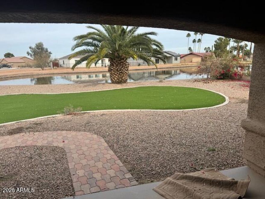 Amazing LAKE  FRONT 3 bed 2 bath, fully landscaped TURF front and backyard and on a block fenced lot in Arizona City! NEW stainless steel range,dishwasher and microwave, upgraded cabinetry, countertops, NEW inside paint, all tile throughout, no carpet,, extended patio and driveway, tile roof and more.