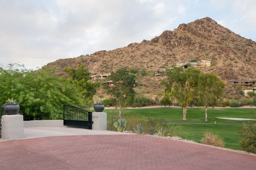 2017 TOTAL REMODEL among the most prestigious addresses in the state. Designed by Bill Tull, named a “Master of the Southwest,” with direct access to Paradise Valley Country Club, this privately gated estate with only 4 neighbors sits on nearly 1.5 acres of the state’s most desirable land, bordering the signature fairway and the only water feature on PV CC golf course. —Unencumbered views of Camelback Mountain, Mummy Mountain, the 8th and 2nd fairways, and the PV CC lake— Complete Smart Home with Amazon Alexa, Wink, Nest, Sonos, and more controlled all from your smart phone, along with all new kitchen, bathrooms, flooring, roof, windows, landscaping and more. Modern, Turn-key amenities with timeless, quality finishes, beautiful architectural history, and unmatched views.