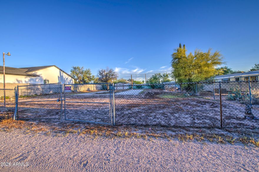 Great level, lot ready to build your dream home or ready to set new mobile on. Located on private street. Views of Superstitions. Metal shed 14x20 on cement slab.  Fully fenced.