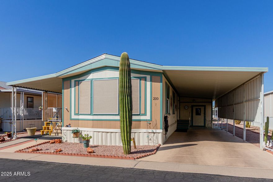 Welcome to this fully furnished, move-in ready 1997 single-wide manufactured home in the guard-gated 55+ community of Superstition Buttes in Apache Junction. This well-maintained 2 bedroom, 2 bathroom home features new laminate flooring, fresh interior paint, faux wood blinds, and an open kitchen with ample cabinetry and included appliances. The primary suite offers a walk-in shower for added comfort, and the home includes a Brand New, full-size interior washer and dryer. Recent updates include a 2017 roof, 2023 gas water heater, and professional leveling with new supports. A transferable Choice Home Warranty is in place through February 8, 2027. Exterior features include two storage sheds (8x8 and 10x14) and a fenced dog relief area. Enjoy resort-style amenities including pickleball, pitch-and-putt golf, heated pool and spa, clubhouse, fitness center, and stunning mountain views. Monthly land lease is $839; buyer approval required. Ideal full-time residence or seasonal retreat near the Superstition Mountains.