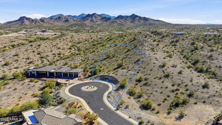 Welcome to your future Custom Home Lot! Largest lot in the exclusive and highly desirable Sonoran Vistas with all Estrella Mountain Ranch has to offer. Sitting on 3/4ac with incredible views, you have plenty of space to build the home of your dreams. Recent home sales in this gated community have sold for well over $1mil. This custom home site is conveniently located within minutes of shopping, dining, and easy access to all the great things happening in Goodyear!