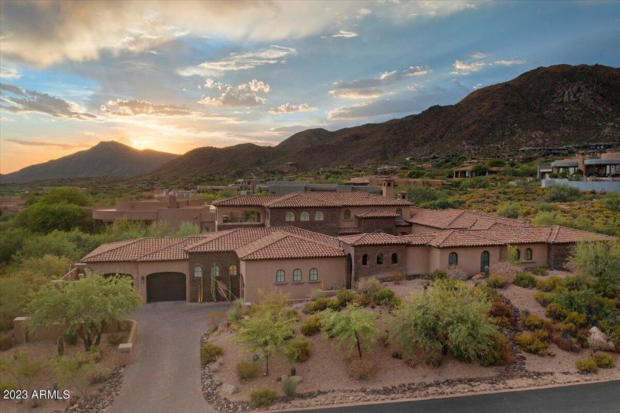 Welcome to Desert Mountain and welcome to this exquisite estate masterpiece that blends warm Mediterranean and soft contemporary into a stunning showcase!  Nestled in Apache Peak w/ incredible views, this nearly new home is loaded with amazing architectural details and features 4 large en-suite bedrooms,  4.5 baths, chef's dream kitchen with top of the line EVERYTHING, and a wine room w/ temp controlled wine wall! The owner's retreat is like being on vacation every day with a large sitting room, fireplace and spa bath that WOWS! The loft is the perfect flex space w/ a private balcony and views forever! Many distinct outdoor spaces and fireplaces complete the picture of true luxury living! This home is paired with a FULL membership, rare and hard to come by-skip the years long waiting list