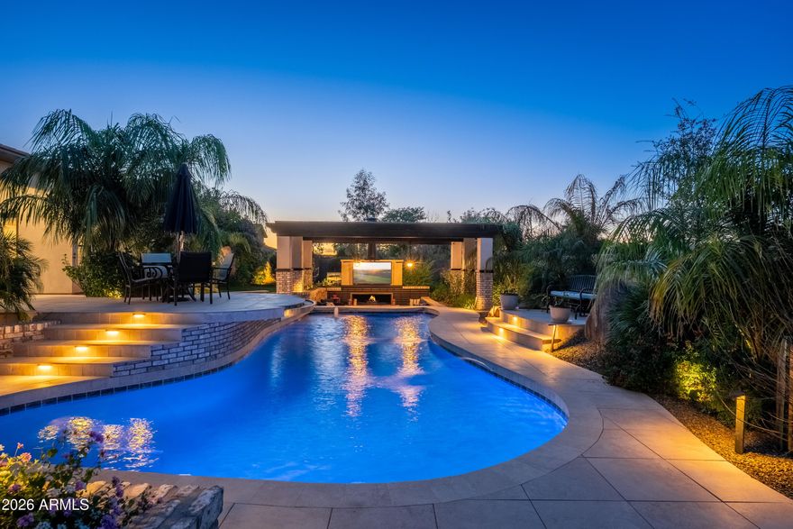 Behind the gates of an exclusive North Glendale enclave, this custom 7-bedroom, 6.5-bath basement estate delivers refined luxury designed for real living. A thoughtfully crafted floor plan balances impressive entertaining spaces with quiet retreats, including a private casita with separate entrance and garage, a split owner's suite, and multiple en-suite bedrooms. Open-concept living blends seamlessly with formal spaces and effortless indoor-outdoor flow. The finished basement offers a secondary great room, mini kitchen, theater, and guest quarters. Outdoors, a resort-inspired setting with lush landscaping, sunken ramada, and PebbleTec pool creates a private backdrop for elevated Arizona living.