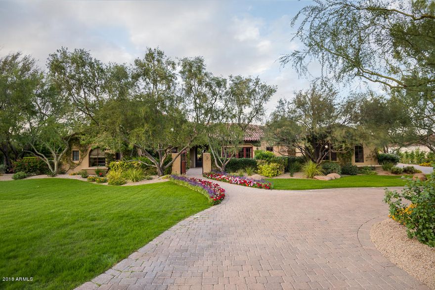 Tucked within iconic Casa Blanca Estates.... this custom built estate is meticulously crafted with all of the finest features you would come to expect.  This meticulous 5 bedroom / 5.5 bath PLUS guest house home features retractable walls of glass, hand scraped, wide planked walnut flooring, custom built ins, a gourmet kitchen with dual side by side Sub Zero refrigerator/freezer / double ovens / a six burner gas range and under counter wine storage.  The outside is the shining star here which only accentuates the interior beauty by mimicking it in the surrounding landscape, pool and patios. Designed and executed by the incomparable Berghoff Landscape and Design, the multiple patio / sitting areas, the lush green landscape and the resort worthy pool will rival any 5 star hotel. Multiple outdoor fireplaces/pits, Camelback Mountain views, spacious grassy play area, sport court, putting green, misting system and water features grace this swoon worthy estate!