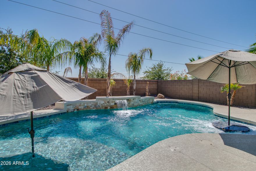 BACK ON MARKET - Buyer could not perform.  DON'T MISS this Stunning Pool Home on a 15,000+ Oversized Corner Lot with Office, Gourmet Kitchen & Split Floor Plan!  Beautifully maintained home features a sparkling pool, gas fire pit, and built-in grill -- the perfect outdoor space for relaxing or entertaining year-round.  Inside, you'll find tile flooring throughout the entryway, hallways, kitchen, and bathrooms, with newer laminate flooring in the bedrooms for added comfort and durability. The upgraded kitchen is a chef's dream, showcasing granite countertops, stainless steel appliances, a gas cooktop, abundant storage, rich 42-inch wood cabinetry and oversized island.  Working from home is easy in the thoughtfully designed office featuring custom built-in cabinetry, filing drawers, and quartz countertops for a functional and stylish workspace.  The desirable split floor plan offers added privacy, highlighted by an oversized primary suite complete with a spacious walk-in closet, dual-sink granite vanity, and a separate tub and shower. This home combines comfort, functionality, and exceptional outdoor living -- a must-see!