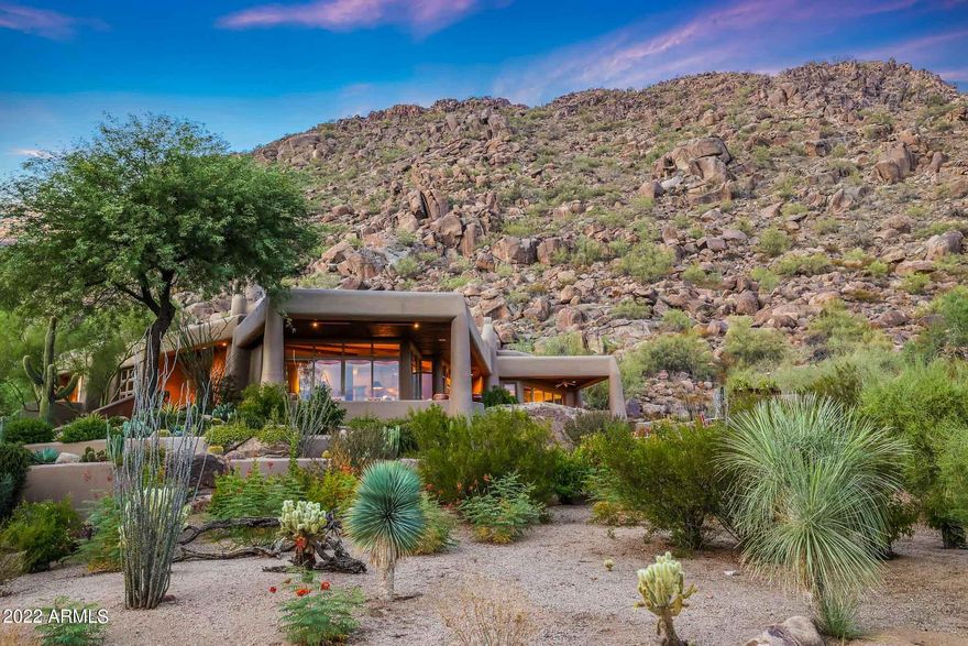 Welcome to your desert dream retreat nestled in Desert Highlands! Backing up to the mountain with the most stunning views and total privacy! AC's replaced and roof has been redone. Elevator too! Southwestern style charm with viga beams and wooden accents! Eat- in kitchen with double ovens and Sub-Zero fridge. Entertainer's dream with wet bar in living room and backyard access! Master suite with fireplace and access to covered patio. Master bathroom with dual sinks, jetted tub, walk-in shower, and walk-in closet with built ins. All ensuite bedrooms with walk-in closets and private patios! Separate casita with mini fridge and full bathroom. Pella windows, custom wooden doors, and surround sound throughout! Backyard oasis with pool, spa, heaters, and fireplace overlooking the serene views