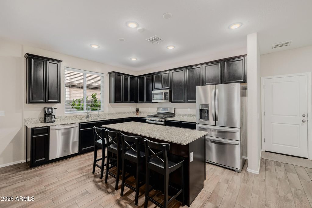 Photo of 13496 W Range Mule Drive, Peoria, AZ 85383 (MLS # 6996783)