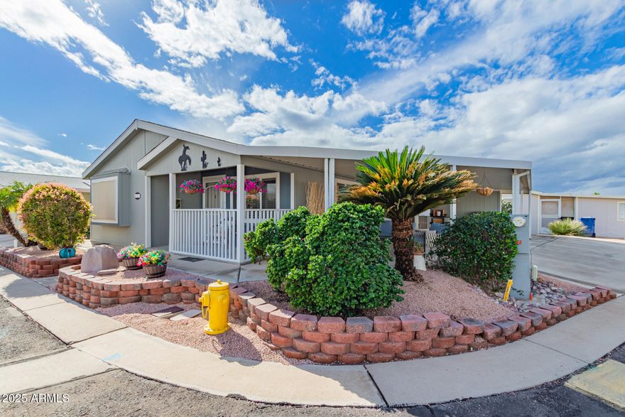 Beautifully maintained home in a desirable 55+ gated community with a LOW lot lease! Tucked away in a quiet and peaceful setting, this charming home sits on a spacious corner lot with beautiful landscaping and an easy-care drip irrigation system.  Enjoy peace of mind with major updates already completed, including HVAC, stainless steel refrigerator, dishwasher, gas water heater, interior paint (2023), and a roof inspected last year with an estimated 10+ years of remaining life. The home also features premium oversized Electrolux washer and dryer units with built-in pedestal storage and convenient pull-down laundry hampers.  Relax on the inviting covered porch with your favorite morning coffee or evening beverage while enjoying the serene surroundings. Additional highlights include a large carport, oversized storage shed, and pride of ownership throughout. Residents enjoy resort-style community amenities including a heated pool and spa, fitness center, clubhouse, shuffleboard courts, putting green, and fun organized monthly social events.  Lot lease is only $714/month and includes sewer, and trash services. Buyer must complete community application and receive park approval prior to ownership. Applicants must have a minimum 700 FICO score, verifiable income of at least 3x the monthly lot lease, and pass a background check. Application available in the documents tab.