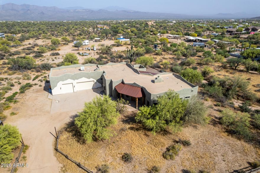 Fantastic opportunity to own this 4-bedroom home on a sprawling 2.5-acre horse property! You're welcomed by a 3-car garage, natural desert landscape, and an inviting front patio. Fall in love with the captivating living room with high ceilings, a soothing palette, recessed lighting, All new Saltillo tile flooring, interior paint, and a stone-clad fireplace. The stunning eat-in kitchen comes with granite counters, ample wood cabinetry, a stone-tile backsplash, stainless steel appliances, a pantry, and an island with a breakfast bar. The primary bedroom showcases sliding door access to the backyard for seamless indoor-outdoor flow, a private bathroom with dual sinks, and a walk-in closet. Unwind on the charming rooftop deck, offering panoramic views of the desert and distant mountains. The expansive outdoor space provides a sizeable covered patio, stylish pavers, and abundant space for crafting your dream outdoor oasis or establishing equestrian facilities. Don't miss out on this incredible gem!