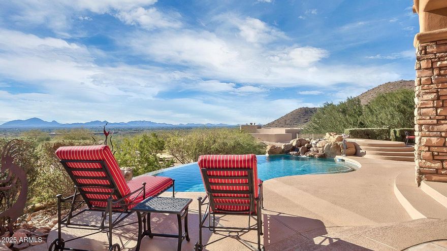 Experience luxury desert living on one of the highest hillside lots with panoramic mountain and city views, situated on a cul-de-sac in guard gated Ancala.  This home boasts 14' ceilings, a renovated gourmet kitchen with Viking and Dacor appliances, 5800 bottle chilled wine cellar plus additional beverage/wine fridges, custom Knotty Alder doors and cabinetry, and honed travertine flooring throughout. Each bedroom offers an ensuite bath and walk-in closet. The primary suite features a travertine fireplace, private patio access, an oversized walk-in closet, jetted tub, bidet, and luxurious finishes. The oversized 3-car garage and fully outfitted casita with kitchenette and ensuite bath complete this exceptional home.  Smart home upgrades include Nest thermostats, surround sound, central vac, and a brand-new AquaLink pool system and refinished pebble sheen pool and spa.  Entertain effortlessly with a chef's gas BBQ, firepit, misting system, and large grassy yard.  Additional highlights include wet bar, new LED lighting, updated fans and fixtures, custom vent covers, new carpet, remote-controlled blinds, and full brand new roof (underlayment, tile and flat portion) and new exterior paint. Truly turnkey - style, comfort, and functionality all in one.